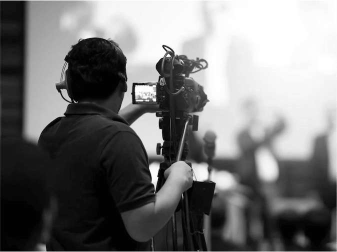 Camera operator filming on a Flow Productions video set