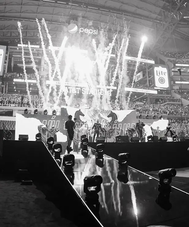 Flow Productions stage production with pyrotechnics at a stadium event