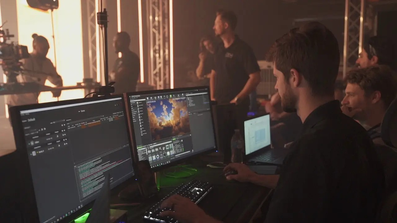 Operators at the studio control room running virtual production software